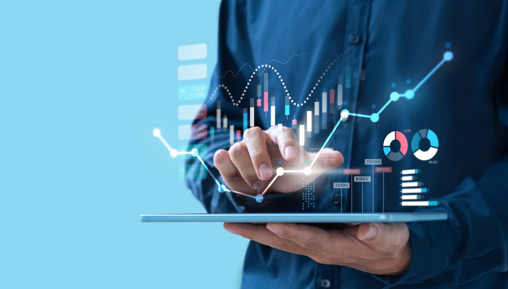 Businessman trading online stock market on teblet screen, digital investment concept Businessman trading online stock market on teblet screen, digital investment concept